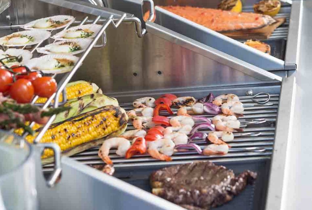 Stainless Steel Modular Outdoor Kitchen with Built in Double Grill, Refrigerator, Side Burner, Sink and storage cabinets.