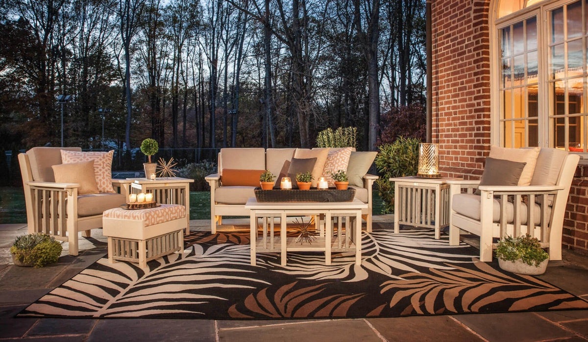 Weather-resistant outdoor furniture arranged for dining and relaxed conversation